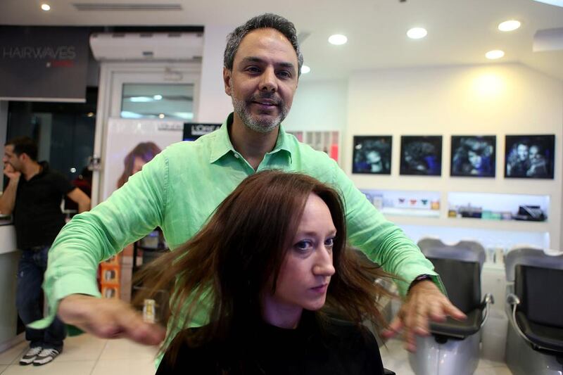 The Lebanese stylist Charbel Doumit styles Sarah Ferguson hair at his salon, Hairwaves, in Abu Dhabi. Sammy Dallal / The National