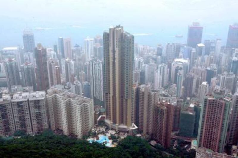 "Conduit Road 39", a luxurious residential building developed by Henderson Land Development, located at Hong Kong's Mid-Levels district and facing the Victoria Harbour, is seen from the Peak October 14, 2009. A 6,158 -square-feet deluxe duplex in this building has sold for HK$71,280 (US$9,100) per square foot, setting a world record per square foot for an apartment and surpassing London prices, the developer said on Wednesday. Property prices in Hong Kong have surged 26 percent this year, despite the economic downturn, amid low new supply and strong demand for luxury property from wealthy Chinese.    REUTERS/Bobby Yip  (CHINA POLITICS BUSINESS) *** Local Caption ***  HKG02_HONGKONG-PROP_1014_11.JPG