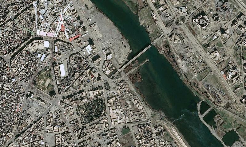 An aerial view of the second of Mosul's five destroyed bridges across the Tigris River, captured on February 19, 2017. Distribution Airbus DS / CNES / AFP

