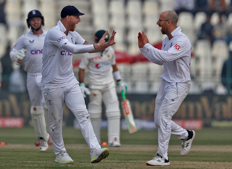 England spinner Jack Leach and captain Ben Stokes celebrate the dismissal of Mohammad Rizwan. Reuters