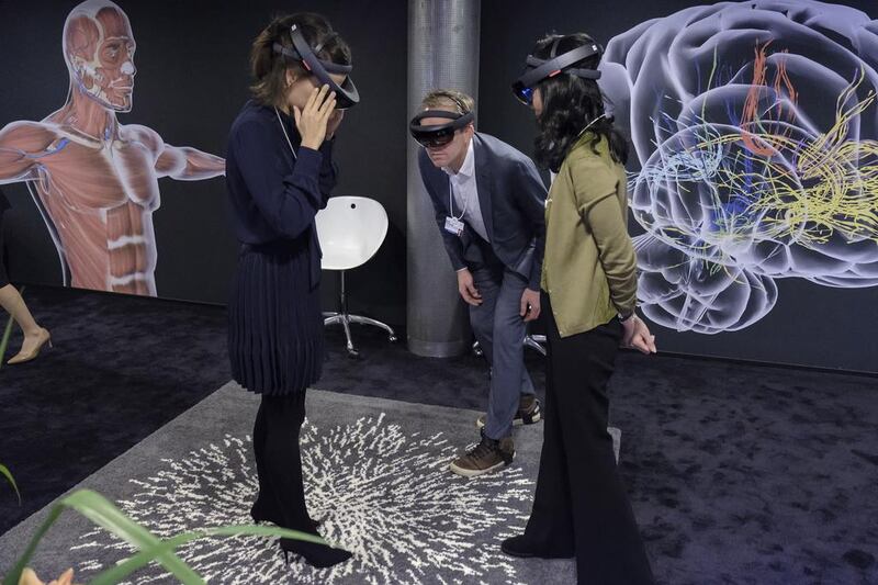 Participants join a guided holographic scientific exploration at the World Economic Forum in Davos. Walter Duerst / World Economic Forum