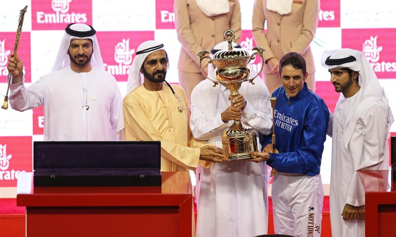 Sheikh Mohammed bin Rashid and Sheikh Hamdan bin Mohammed celebrate, with trainer Saeed bin Suroor and jockey Christophe Soumillon of Belgium, after the Dubai Ruler's horse Thunder Snow won the Dubai World Cup main race at the Meydan race course on Saturday. Ali Haidar / EPA