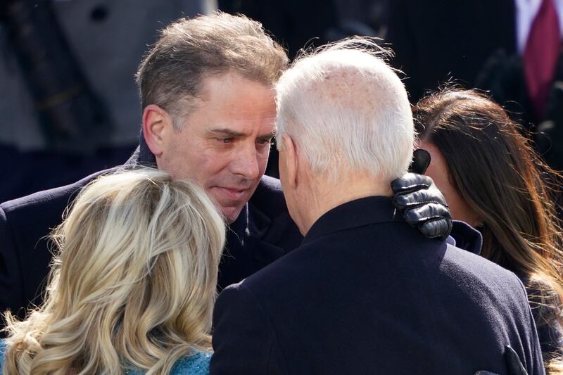 US President Joe Biden and son Hunter Biden hug with other family members at his inauguration in Washington, on January 20, 2021. AP