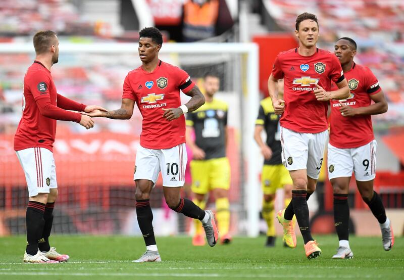 Manchester United's Marcus Rashford, second left, is congratulated after scoring his team's first goal against Southampton at Old. AP