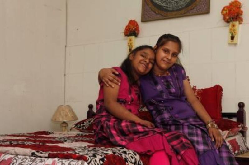 Ajman, 11th May 2011.  (Right to left) Zynab Gulab Ibrahim (14 years old) and Fatima Gulab Ibrahim both special needs sisters from Pakistan, at their residence.  (Jeffrey E Biteng / The National)