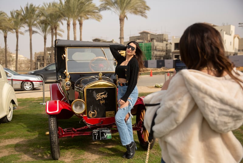 Car enthusiast Carine Sherif poses in front of Mr Wahdan's 1924 Ford T at a classic car show in Cairo.