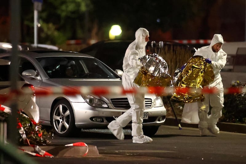 Forensic experts work after a shooting in Hanau near Frankfurt. Reuters