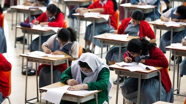Students at the Abu Dhabi Indian School take exams. Andrew Henderson / The National