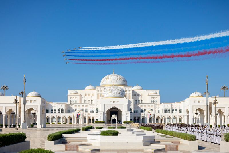 Al Fursan aerobatic team performs during Mr Putin's state visit, in Abu Dhabi. Ryan Carter / Presidential Court