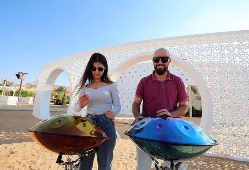 Musicians play the hand pan at Liwa Village