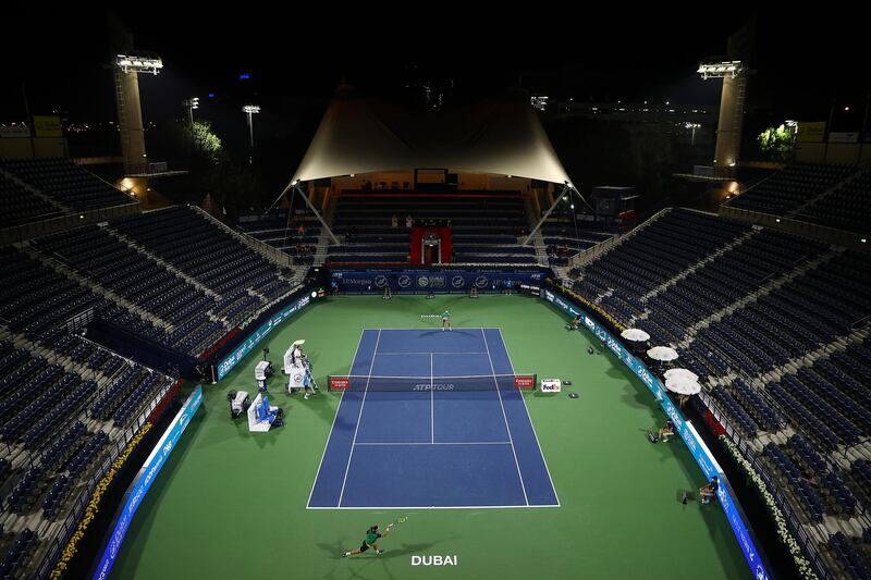 DUBAI, UNITED ARAB EMIRATES - MARCH 20:   Lloyd Harris of South Africa returns the ball during the men's singles Final match against Aslan Karatsev of Russia during day fourteen of the Dubai Duty Free Tennis at Dubai Duty Free Tennis Stadium on March 20, 2021 in Dubai, United Arab Emirates. (Photo by Francois Nel/Getty Images)