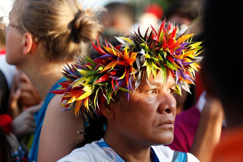 Worshipers participate in a welcoming ceremony. AP Photo