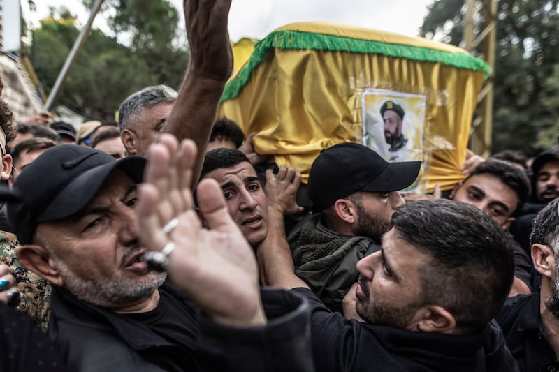Hezbollah supporters carry the coffin of a Hezbollah militant. Getty Images