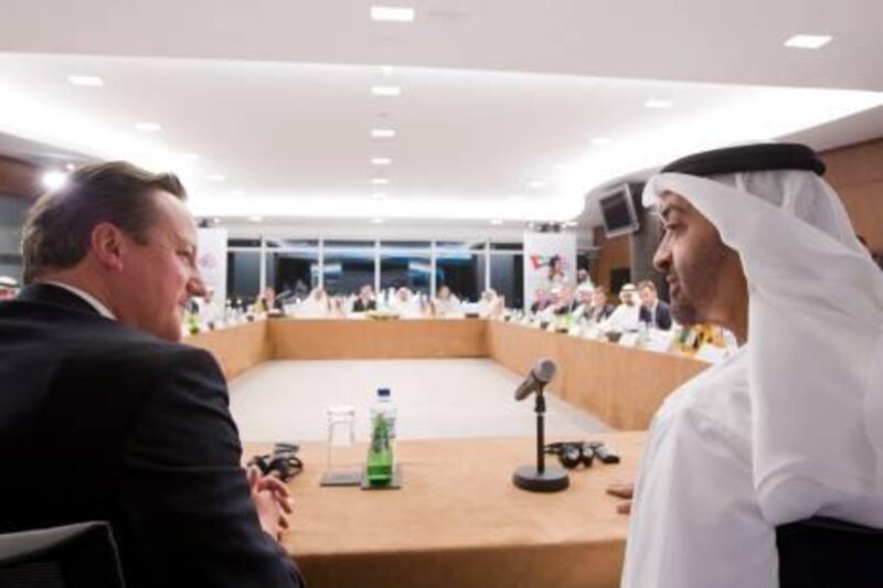 ABU DHABI, UNITED ARAB EMIRATES - November 5, 2012: HH General Sheikh Mohamed bin Zayed Al Nahyan Crown Prince of Abu Dhabi Deputy Supreme Commander of the UAE Armed Forces (R), speaks during the "Partners of Innovation" meeting. Seen with The Right Honourable David Cameron Prime Minister of the United Kingdom (L). .( Ryan Carter / Crown Prince Court - Abu Dhabi )...
