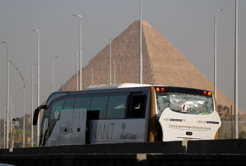 A damaged bus is seen at the site of a blast near a new museum being built close to the Giza pyramids in Cairo, Egypt.  Reuters