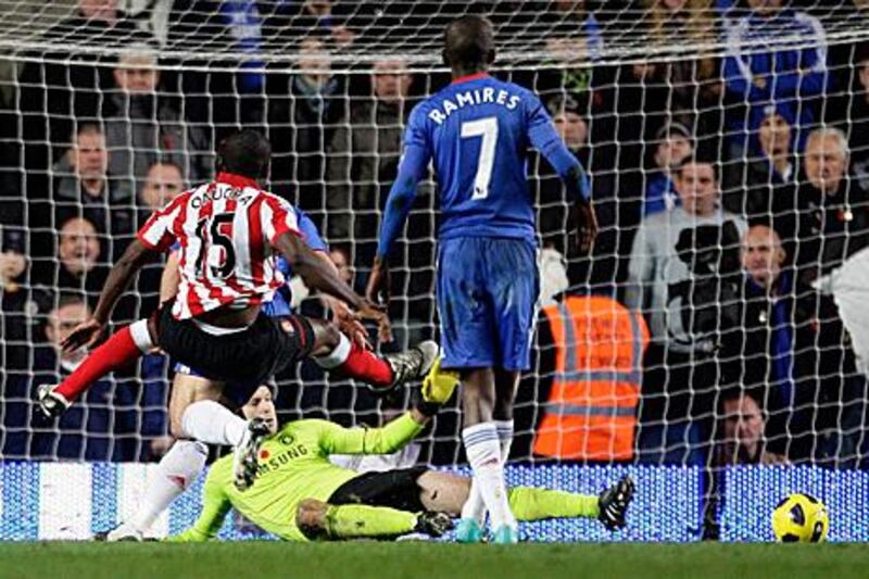 Nedum Onuoha, left, scores the first for Sunderland after a jinking run into the Chelsea box.