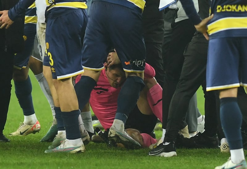 Referee Halil Umut Meler after being after being punched to the ground by Ankaragucu president Faruk Koca. Reuters