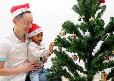Abu Dhabi, United Arab Emirates - December 05, 2018: Tuan Phan with daughter Alma 2. Tuan is a meteorologist by day who blogs for non-profit community SimplyFI.org, which encourages investors to follow the investment principles established by Jack Bogle, the founder of Vanguard. He is one of the personal finance bloggers talking about their Christmas and Christmas advice to avoid blowing your bank account during the festive season. Wednesday the 5th of December 2018 on Yas Island, Abu Dhabi. Chris Whiteoak / The National
