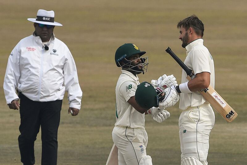 South Africa's Aiden Markram, right, celebrates with teammate Temba Bavuma after reaching his hundred. AFP