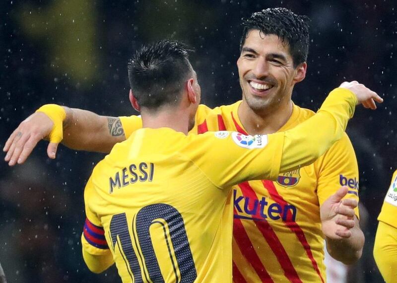 Messi and Luis Suarez celebrate after the game. EPA