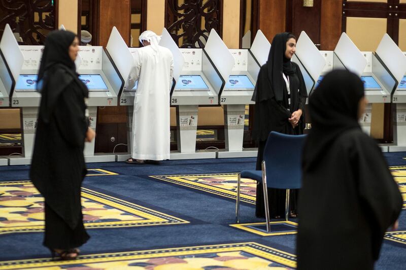 An Emirati man votes by electronic voting system in Dubai. EPA