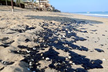 Oil washed up on Al Aqah beach in November 2019. The particles could be seen stretching along the two-kilometre Al Aqah beach and on Dibba beach, 8km to the north. Chris Whiteoak / The National