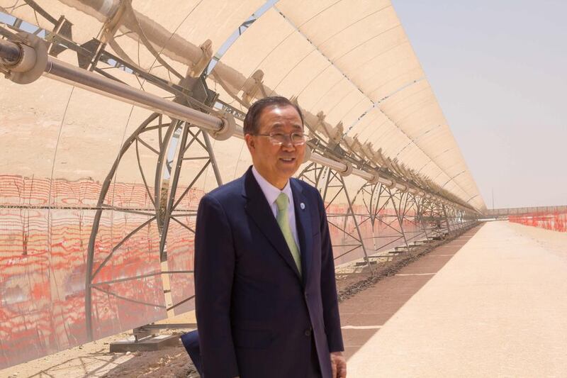 Ban Ki-moon stands in front of a parabolic trough at Masdar's Shams 1 concentrated solar power plant. Courtesy Ministry of Foreign Affairs