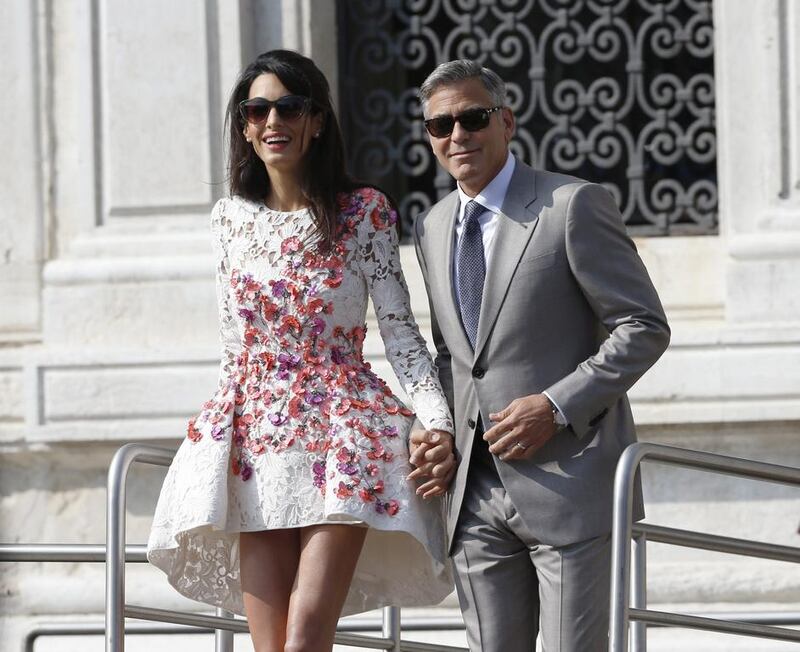 George Clooney married Amal out of sight of pursuing paparazzi and adoring crowds. AP 