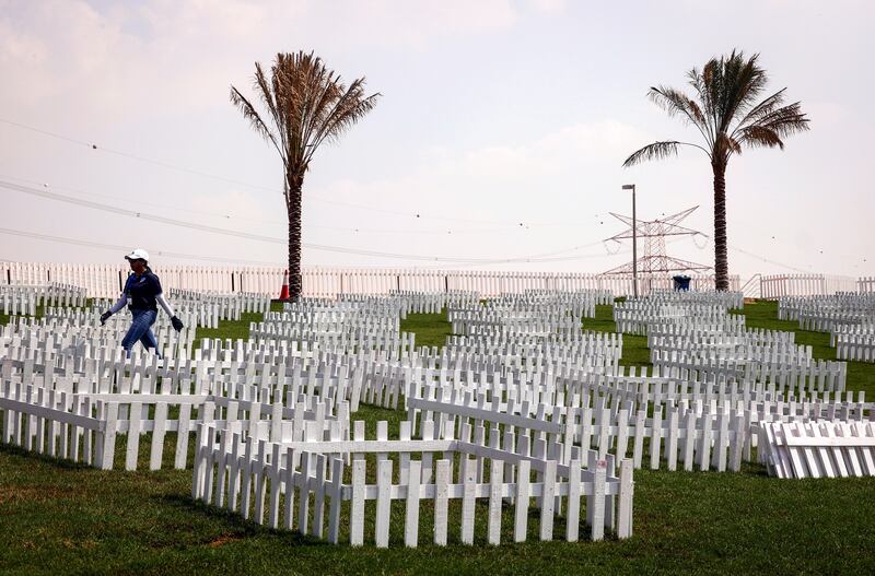 Ground staff erect special enclosures for spectators in Abu Dhabi. EPA