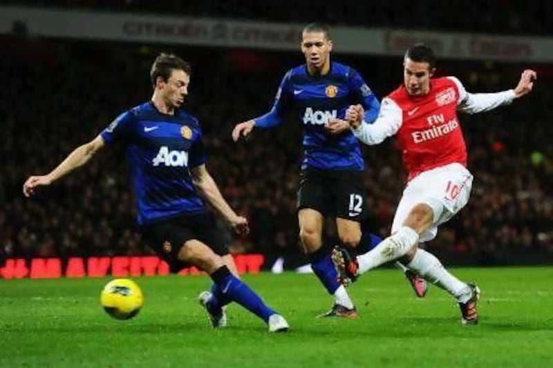 Robin van Persie, right, in action for Arsenal against Manchester United last season, will wear United colours this season.