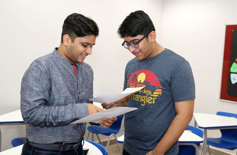 Jay Sunil Goenka, left, and Sumanyu Tonapi are happy after receiving their IB results.