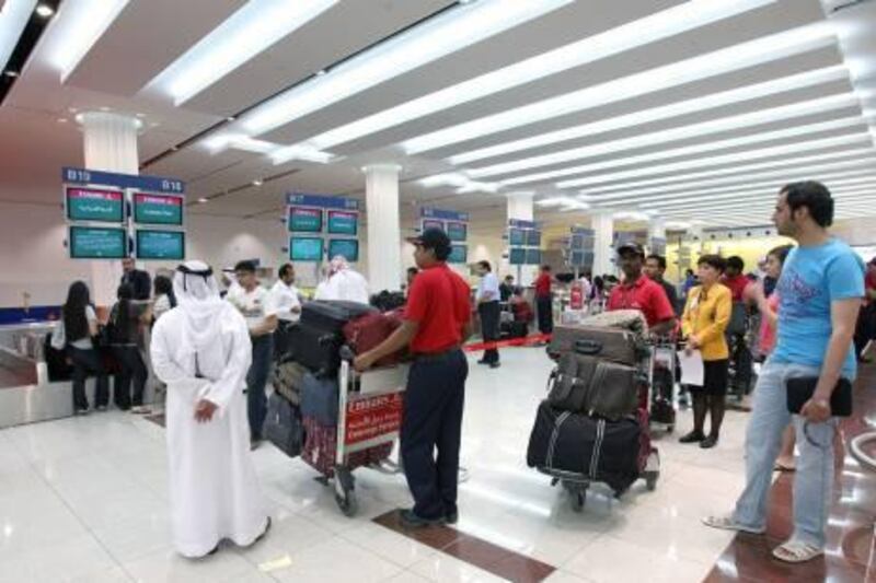 DUBAI, UNITED ARAB EMIRATES - JULY 15:  The Emirates check-in counters at Terminal 3 of the Dubai International airport in Dubai on July 15, 2009.  (Randi Sokoloff / The National)  For Travel story by Daniel Bardsley on baggage handling
 *** Local Caption ***  RS004-071509-BAGGAGE.jpgBZ15SE DUBAI AIRPORT 02.jpg