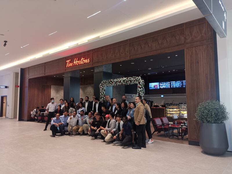 The Tim Hortons team celebrates the opening.