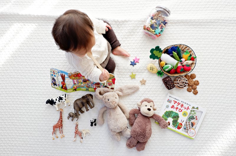 Experts agree that children should be exposed to an array of different toys as they grow, with a focus on the 'play value' the toy offers. Yuri Shirota / Unsplash