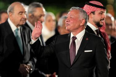 King Abdullah II (2nd-R) of Jordan, flanked by Crown Prince Hussein (R), arrives for an official event commemorating Jordan's 76th Independence Day in the capital Amman on May 25, 2022.  (Photo by Khalil MAZRAAWI  /  AFP)
