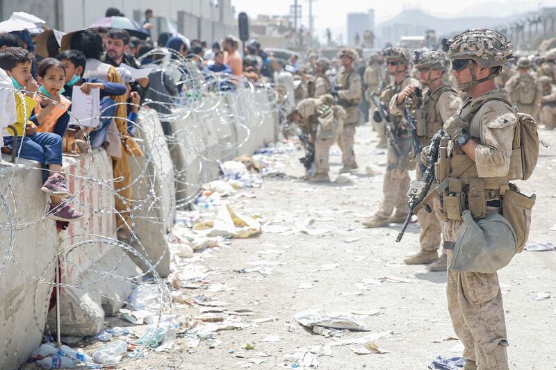 US troops provide assistance at Hamid Karzai International Airport. AFP