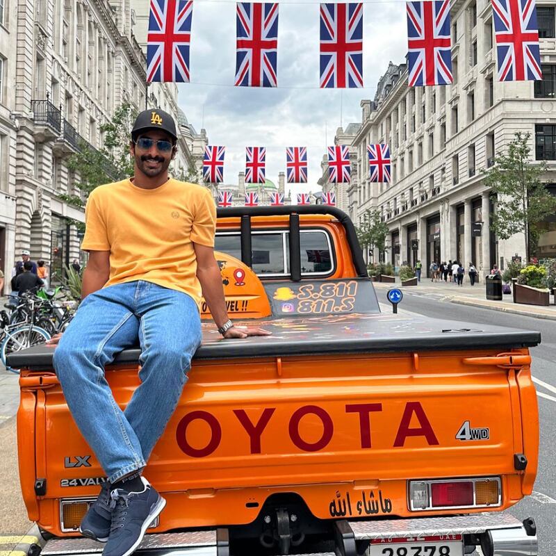Sultan sits on his vehicle in London
