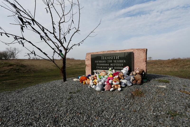 Toys are placed at a memorial to victims of the Malaysia Airlines Flight MH17 plane crash near the village of Hrabove in Donetsk region, Ukraine, on March 9, 2020. Reuters