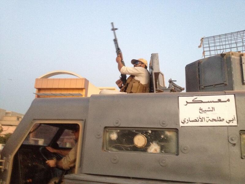 ISIL fighters parade in a stolen armoured vehicle belonging to Iraqi security forces in 2014. As the Iraqi army has cornered the group, ISIL fighters may seek to return to their countries of origiin. (AP Photo)