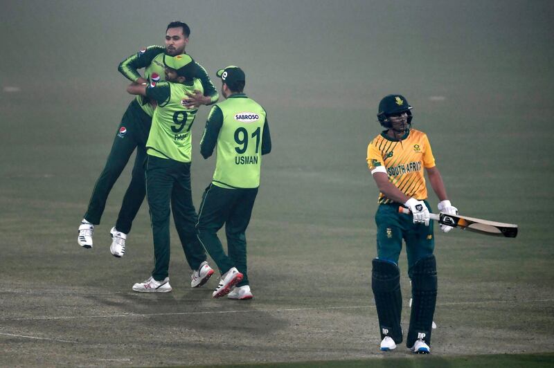 Pakistan's players celebrate after winning the first T20 against South Africa at the Gaddafi Cricket Stadium in Lahore on Thursday, February 11, 2021. AFP