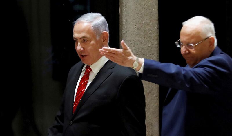 Israeli President Reuven Rivlin and Prime Minister Benjamin Netanyahu arrive to a nomination ceremony at the President's residency in Jerusalem September 25, 2019. Picture taken September 25, 2019. REUTERS/Ronen Zvulun TPX IMAGES OF THE DAY