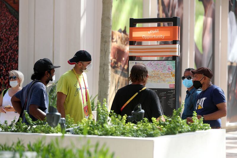 Visitors walk around Expo 2020.