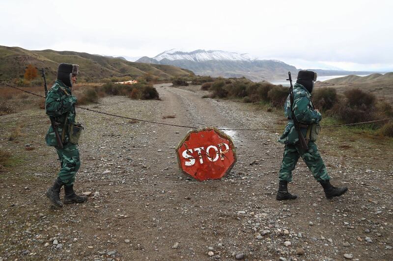 Azeri service members guard the area in Jabrayil District on the Iran border. REUTERS