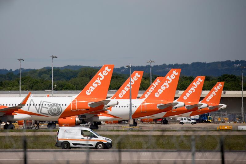 Passenger aircraft operated by Easyjet Plc, stand on the tarmac at London Gatwick Airport, operated by Gatwick Airport Ltd., in Crawley, U.K., on Monday, May 18, 2020. The coronavirus is muddying the outlook for London's second-biggest airport. Photographer: Jason Alden/Bloomberg