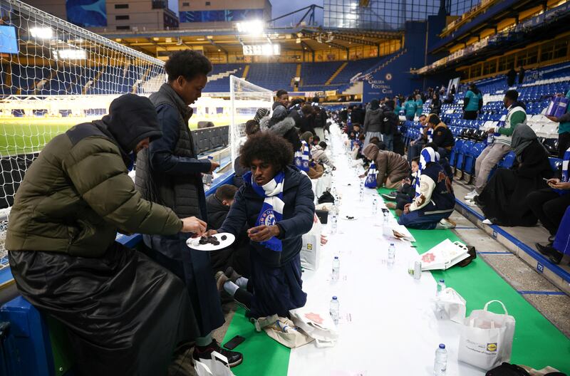 People have their iftar pitch-side at Stamford Bridge stadium, the ground of Chelsea Football Club, during Ramadan in London. Reuters