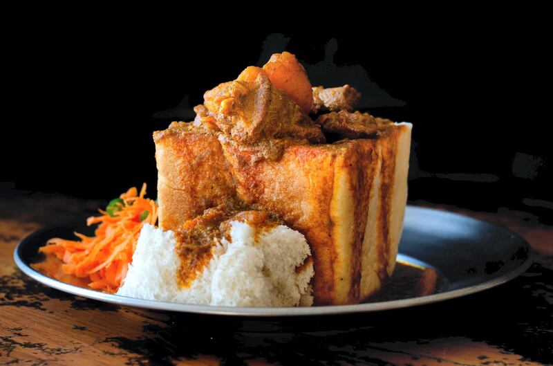 South African goat bunny chow (Dh110), served in a bread loaf. Photo: Punjab Grill