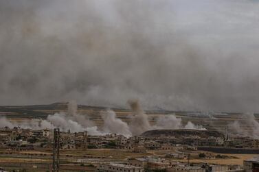 Plumes of smoke rise following reported Syrian government forces' bombardment on the town of Khan Sheikhun in the southern countryside of the militant-held Idlib province, on June 5, 2019. AFP