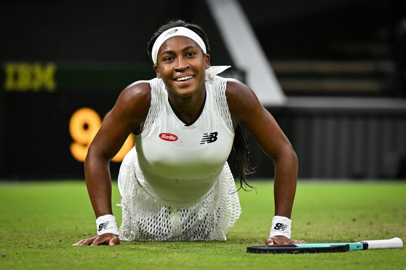 US tennis player Coco Gauff laughs off a slip during her second round singles match against Romania's Mihaela Buzarnescu, at the 2022 Wimbledon Championships in south-west London. Gauff won 6-2, 6-3. AFP