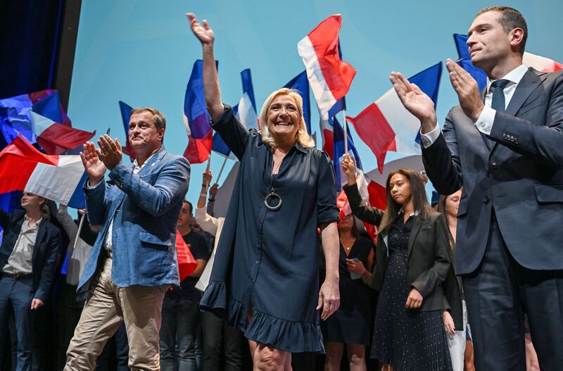 Marine Le Pen waves during French far-right party National Rally interparliamentary days at the Cap d'Agde convention centre, southern France. AFP