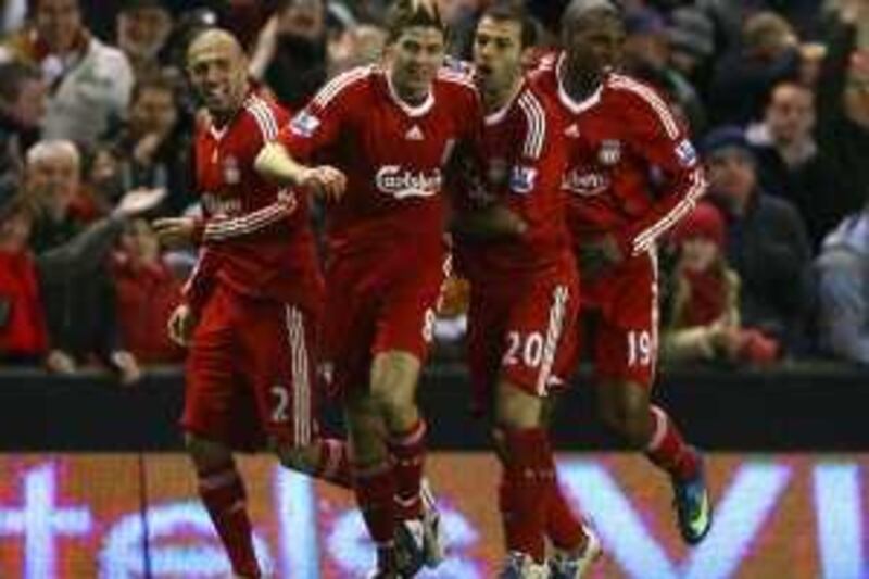 LIVERPOOL, UNITED KINGDOM - JANUARY 25:  Steven Gerrard of Liverpool celebrates with his team mates after scoring his team's first goal during the FA Cup sponsored by E.ON Fourth Round match between Liverpool and Everton at Anfield on January 25, 2009 in Liverpool, England.  (Photo by Alex Livesey/Getty Images) *** Local Caption ***  GYI0056578886.jpg